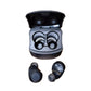 Black Audio-Technica ATH-CKS50TW2 wireless earbuds inside open charging case, showing compact design and built-in battery contacts