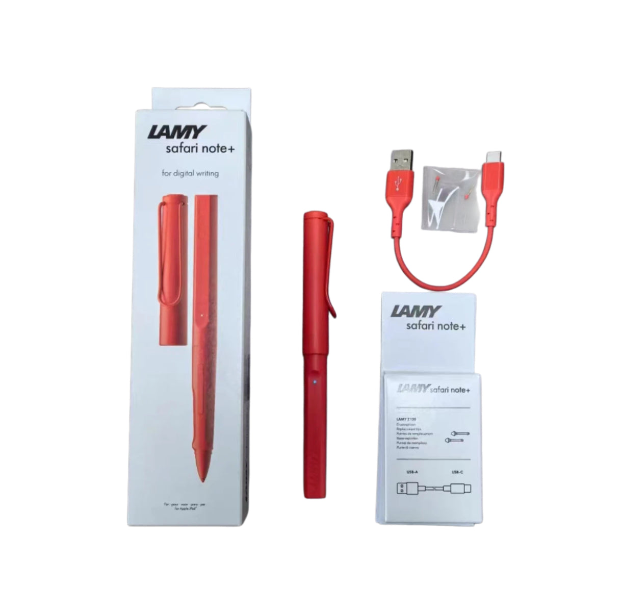 LAMY Safari Note+ red digital pen displayed with original packaging, USB-A to USB-C charging cable, replacement nibs, and instruction card. A premium stylus designed for seamless digital writing on iPad and compatible devices.