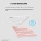 Marketing graphic displaying the white and pink K380 keyboards with a “2-year battery life” badge, emphasizing pre-installed AAA batteries and ultra-low power consumption.