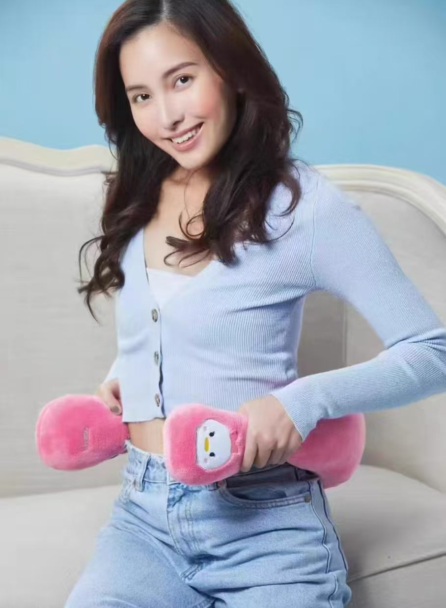 A woman holding the pink OSIM uSnooz massage wrap with Donald Duck faces, using it as a waist support cushion. The plush design offers comfort and flexibility for multiple body positions.