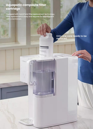  A person easily replacing the Aquaporin composite filter cartridge in the white Philips desktop drinking water machine using the simple QuickTwist technology, no technician required.