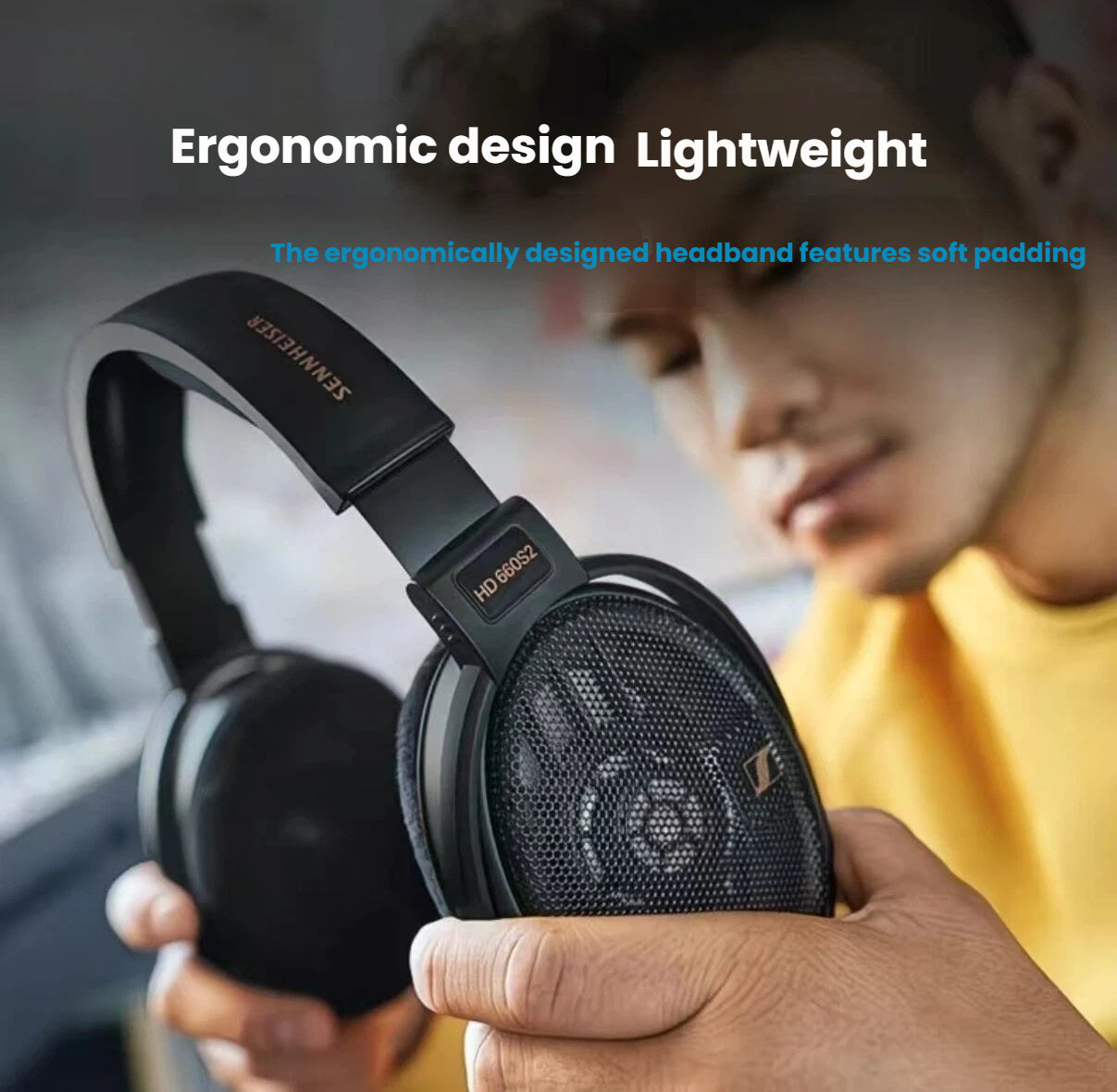 Person holding Sennheiser HD 660 S2 headphones highlighting the ergonomically designed lightweight headband with soft padding for comfortable long-term wear.
