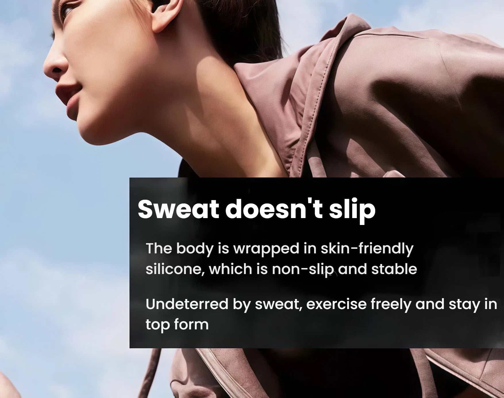 Woman wearing Shokz OpenFit wireless open-ear headphones with skin-friendly silicone coating that resists slipping during intense exercise and sweat.