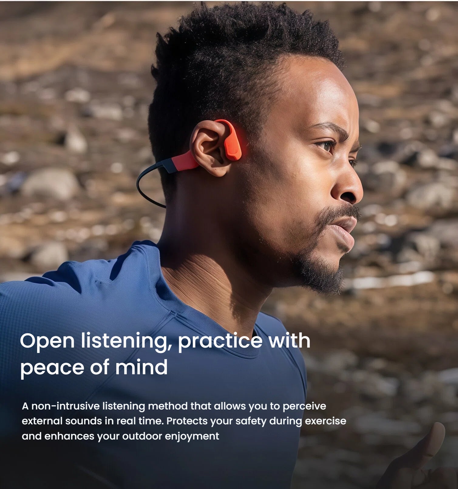 Man running outdoors wearing Shokz OpenSwim Pro bone conduction headphones, enjoying open-ear sound with environmental awareness