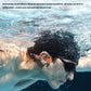 Swimmer using Shokz OpenSwim Pro underwater with built-in sound modes including standard, human voice, and swimming effect for immersive audio