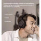 Man wearing Shure AONIC 50 Gen2 headphones, demonstrating comfortable leather ear cushions and foldable design ideal for travel and extended use.