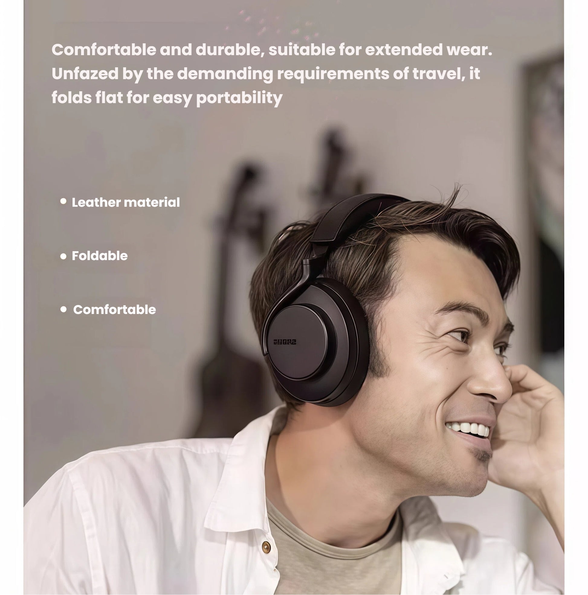 Man wearing Shure AONIC 50 Gen2 headphones, demonstrating comfortable leather ear cushions and foldable design ideal for travel and extended use.