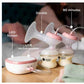 Tommee Tippee double breast pump in use, showing full setup with two bottles filled with milk. Features USB-rechargeable motor unit, LED screen, and 90-minute runtime indicator.