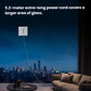 The ECOVACS WINBOT W1S cleaning a large, floor-to-ceiling window at night, showcasing the extensive reach of its 5.2-meter power cord in a modern living room setting.