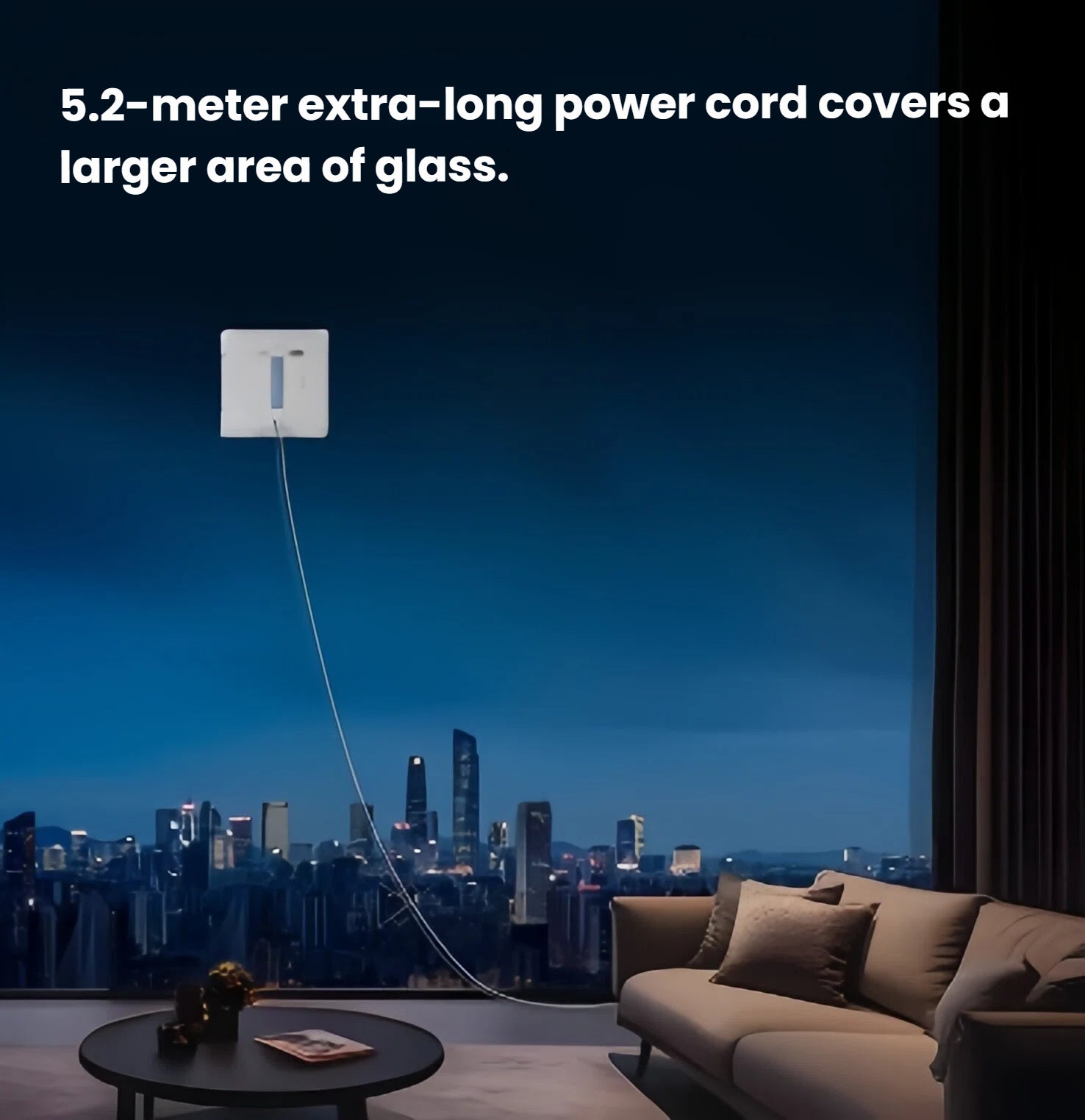 The ECOVACS WINBOT W1S cleaning a large, floor-to-ceiling window at night, showcasing the extensive reach of its 5.2-meter power cord in a modern living room setting.