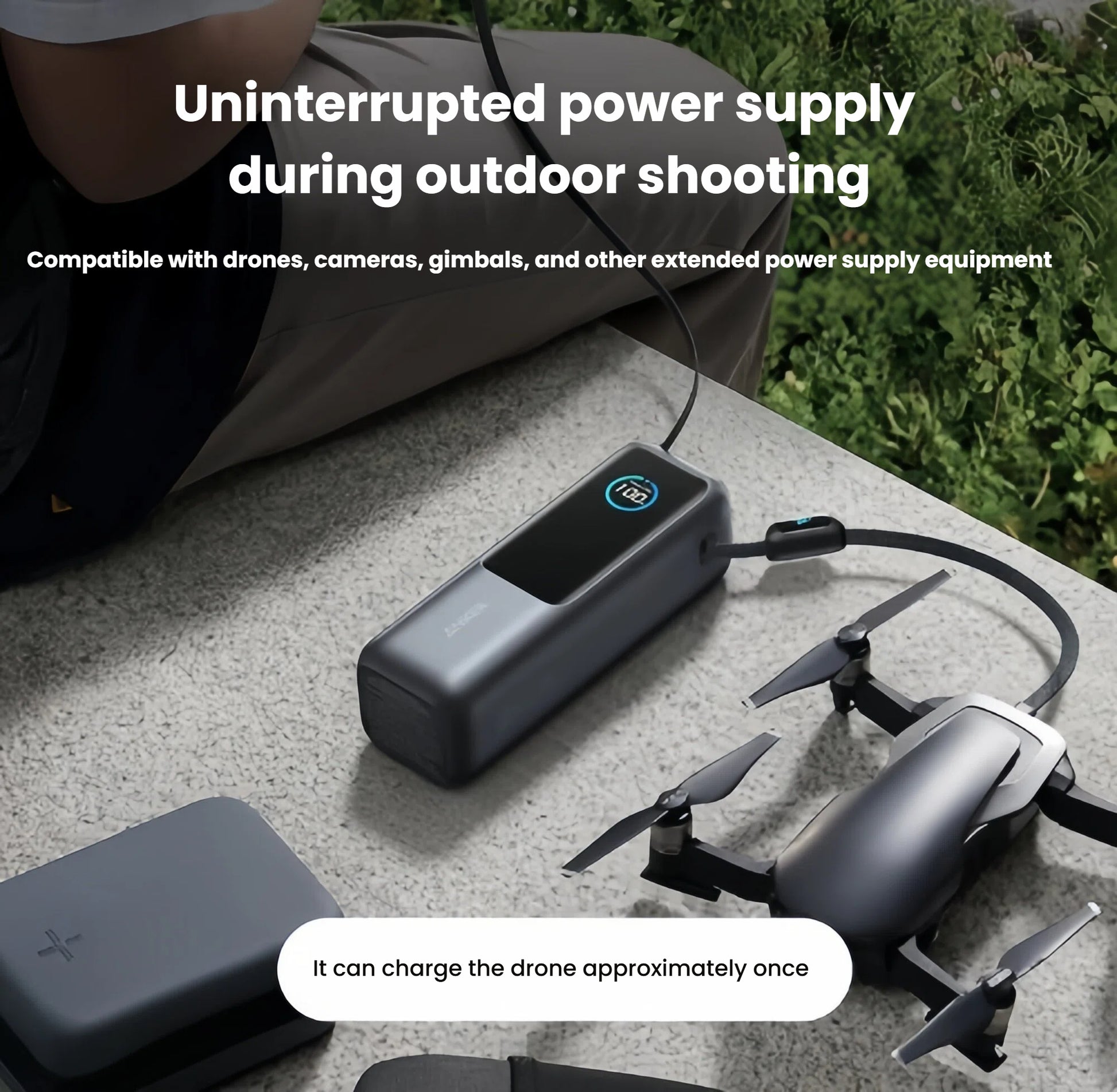 Anker power bank charging a drone outdoors on a table, demonstrating portable power for cameras and gimbals