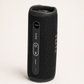 JBL Flip 6 black speaker standing vertically with top control panel