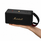 Hand carrying the Marshall Middleton II portable speaker